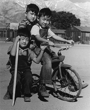 boys on tricycle